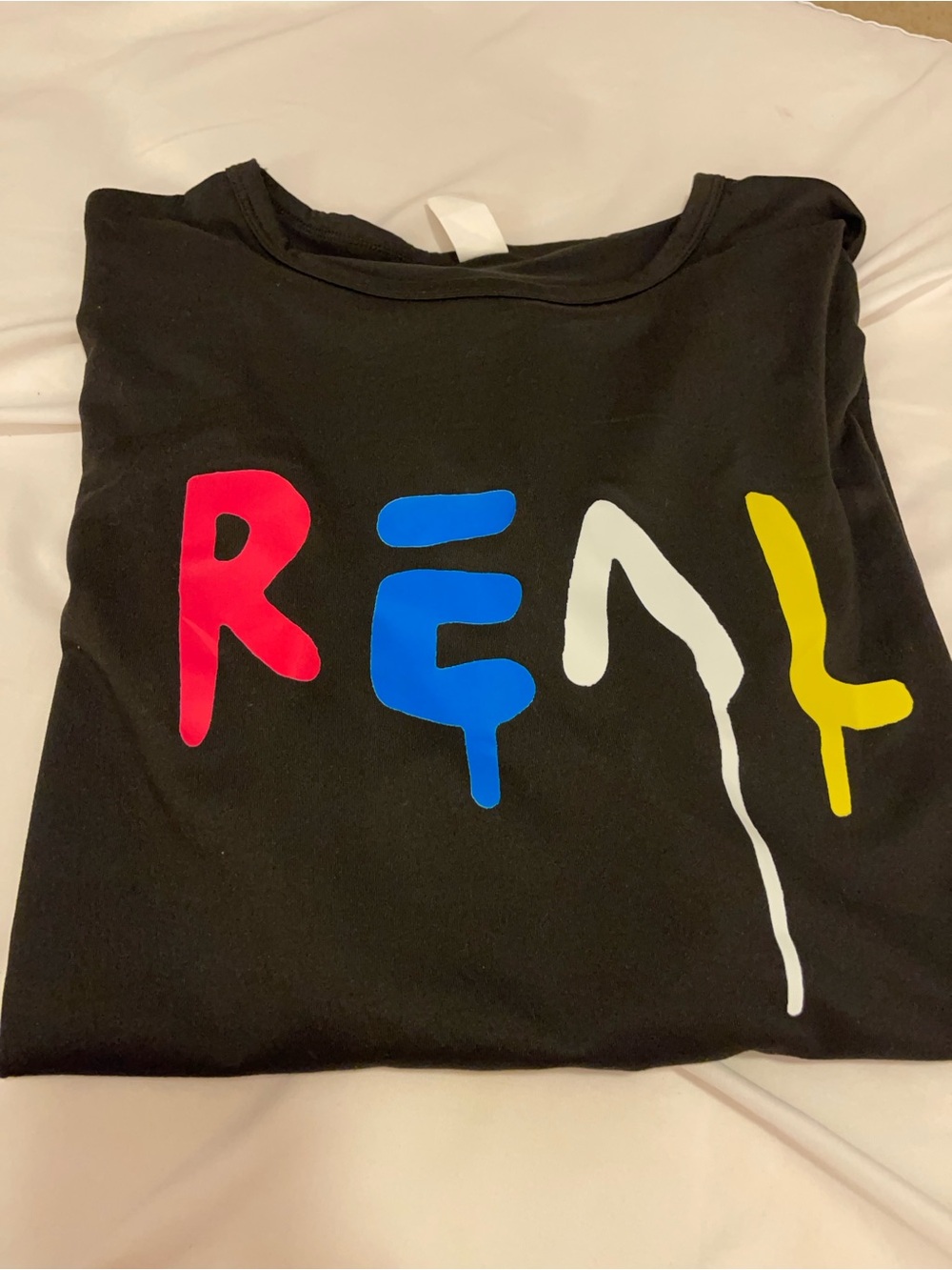 Adult Black Graphic Tee with Colorful 'REAL' Print